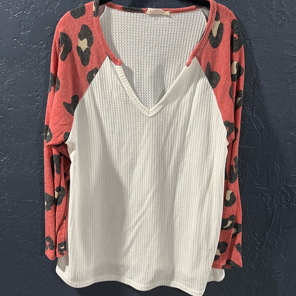 White waffle top with leopard print long sleeves.
